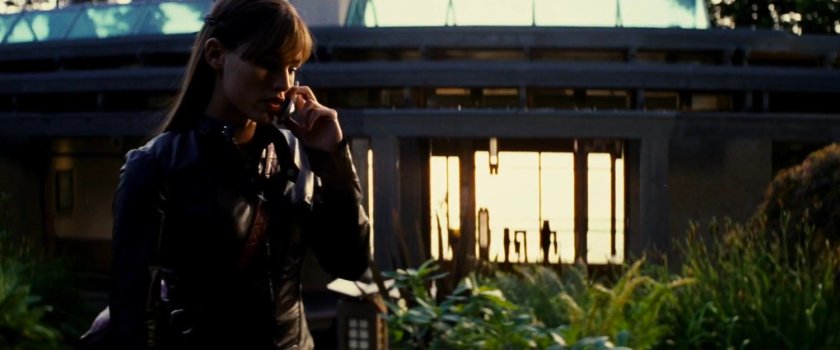 Elektra on phone outside the Wheelwright House.