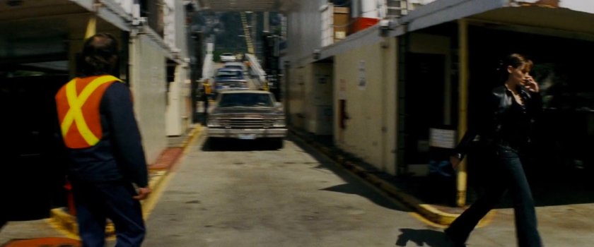 Elektra on the phone walking on a ferry.