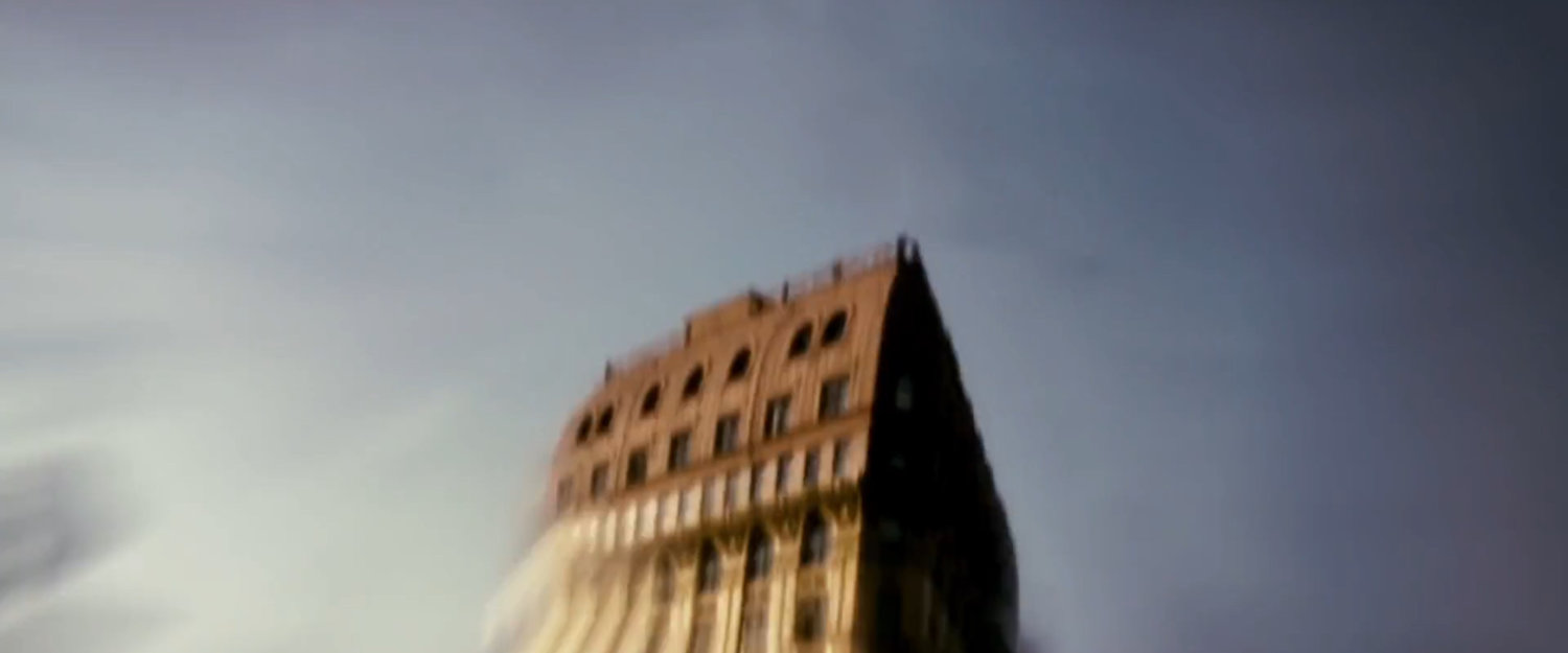 View of tall red building.
