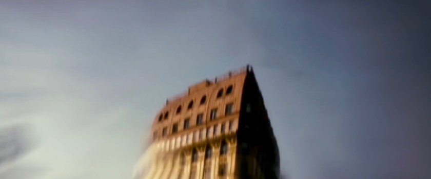 View of tall red building.