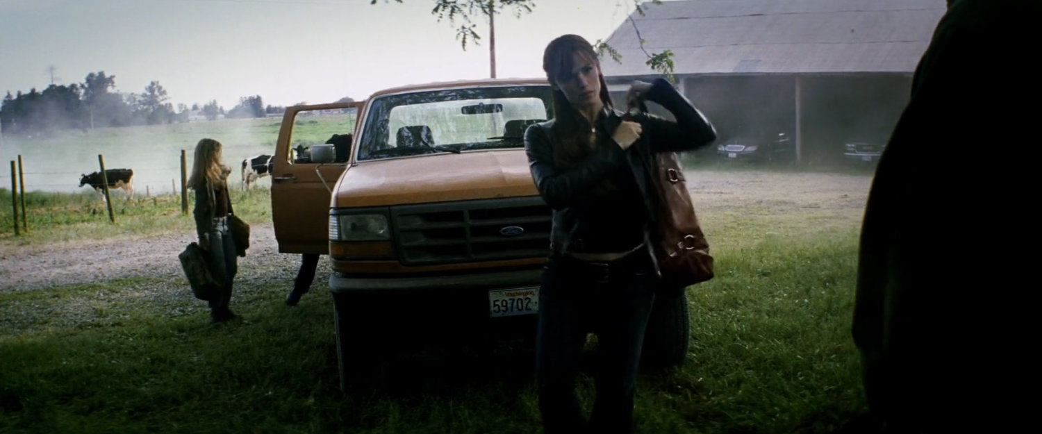Elektra and pickup truck outside the McCabe farmhouse.