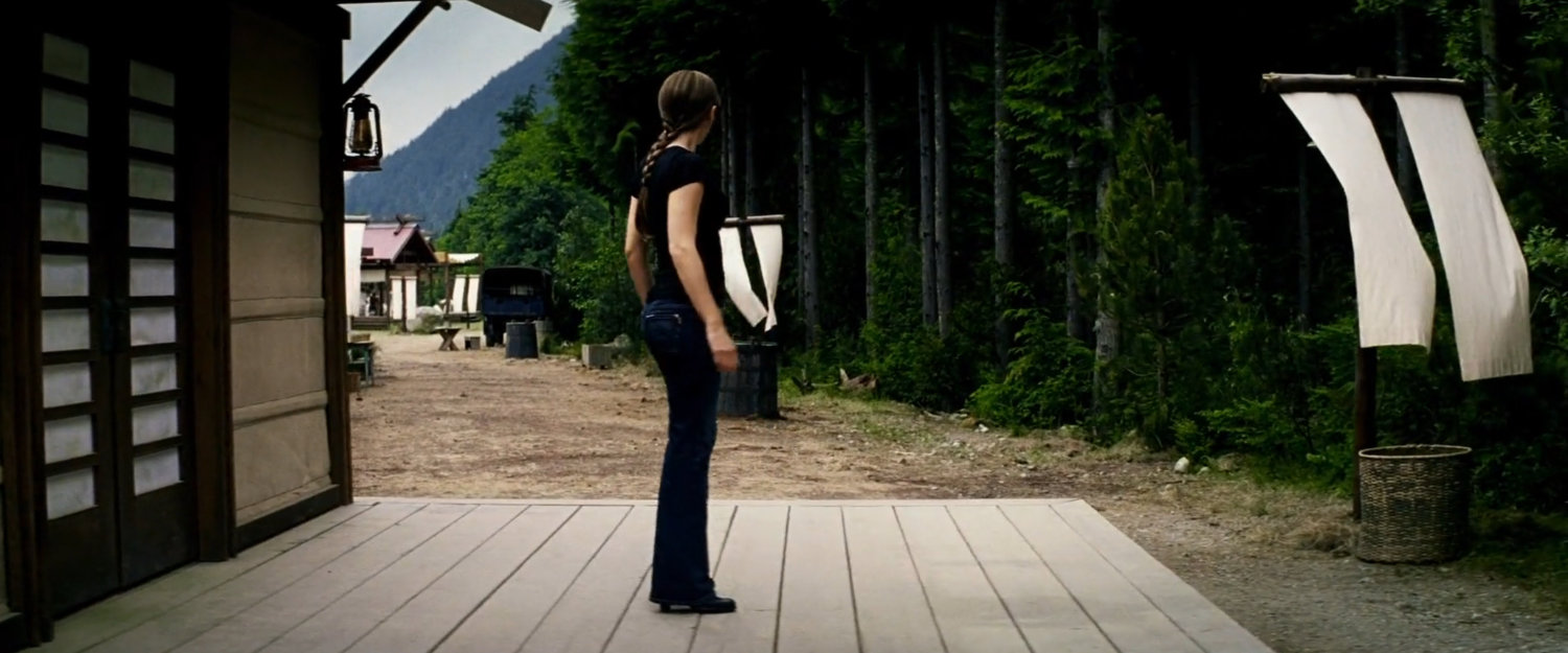Elektra outside small cabin at Chaste camp.