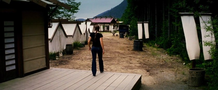 Elektra outside small cabin at Chaste camp.