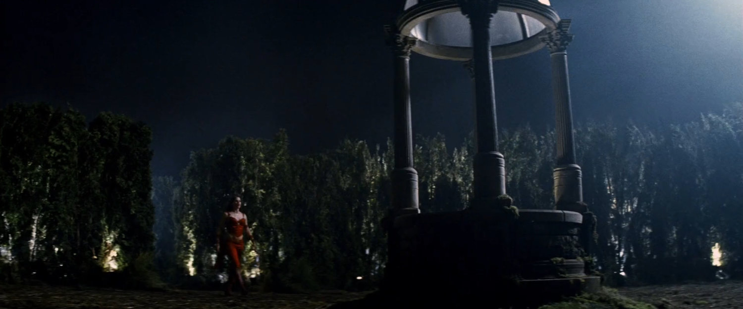 Elektra at the well in the center of the hedge maze.