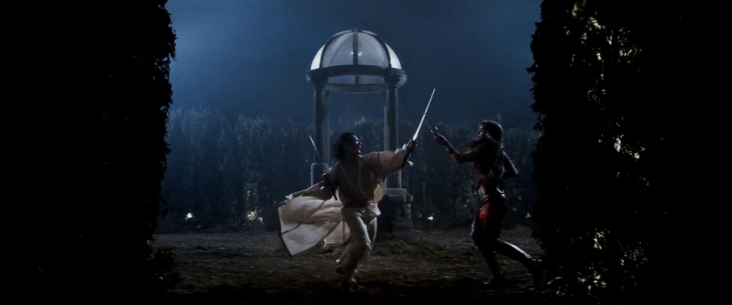 Elektra fighting Kirigi by the well in the center of the hedge maze.