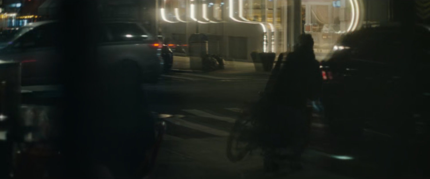 Interstitial: Street corner at night.