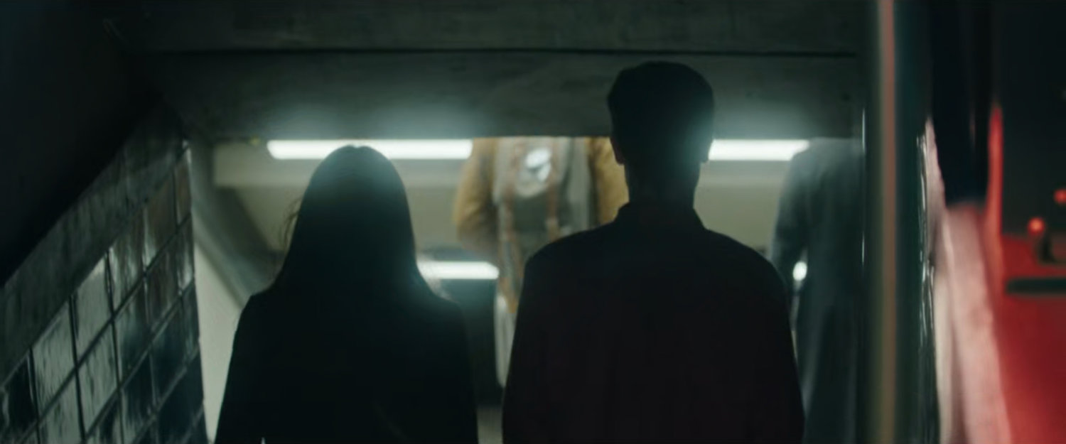 Interstitial: couple walking into subway.