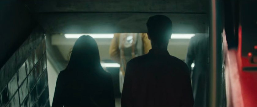 Interstitial: couple walking into subway.