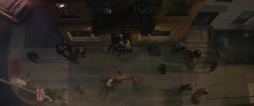 View from rooftop of people outside Josie's bar.