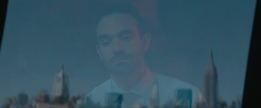 Matt looking out the window of his apartment.