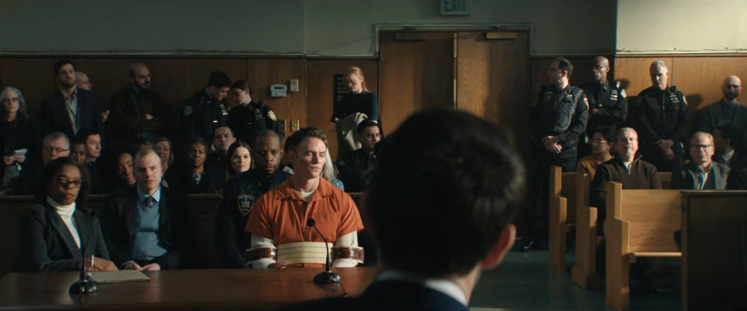 Bullseye in courtroom with onlookers.
