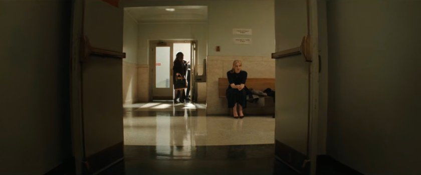 Karen sitting in the hallway outside the court.