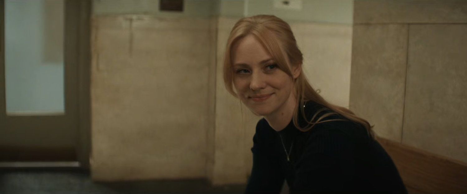 Karen sitting in the hallway outside the court.