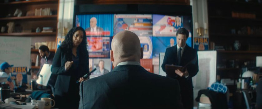 Fisk in front of a video wall at his campaign headquarters.