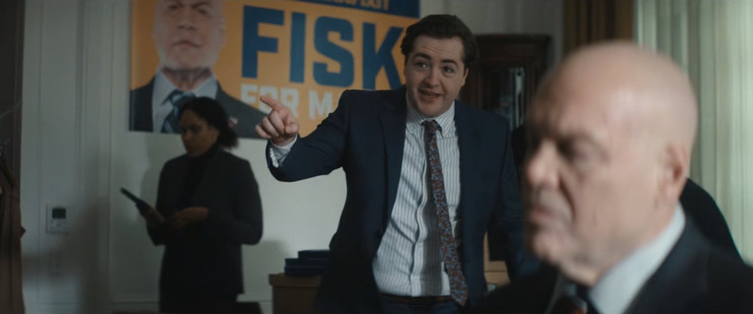 Daniel talking to Fisk in his campaign headquarters.