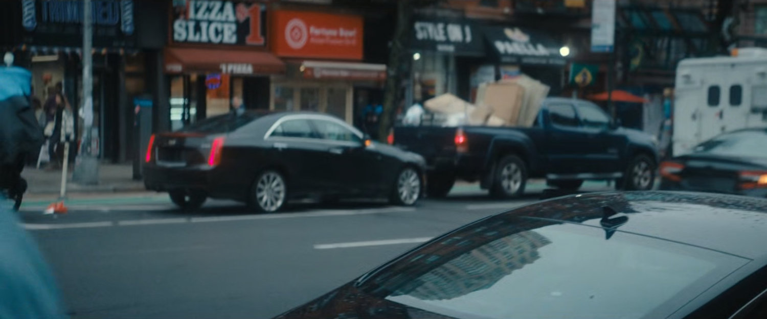 Cars along a New York street.
