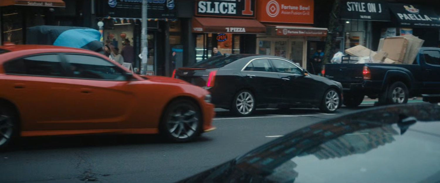 Cars along a New York street.