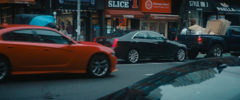 Cars along a New York street.