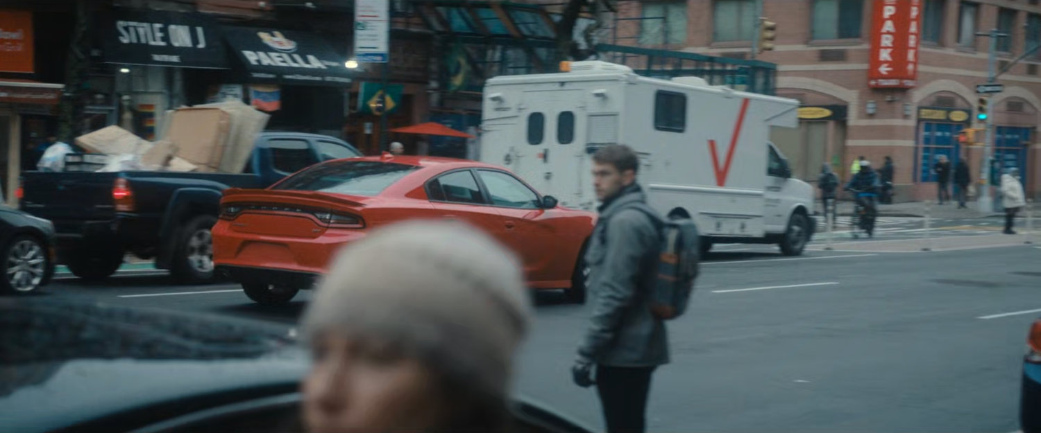 Cars and pedestrians along a New York street.
