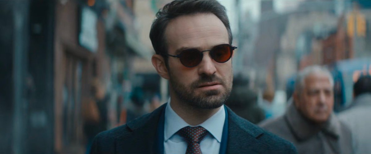 Matt walking along sidewalk.