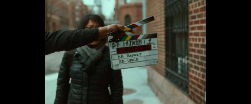 BB Report: slate in front of woman.