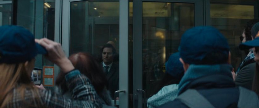 Fisk and team exiting his hotel into crowd.