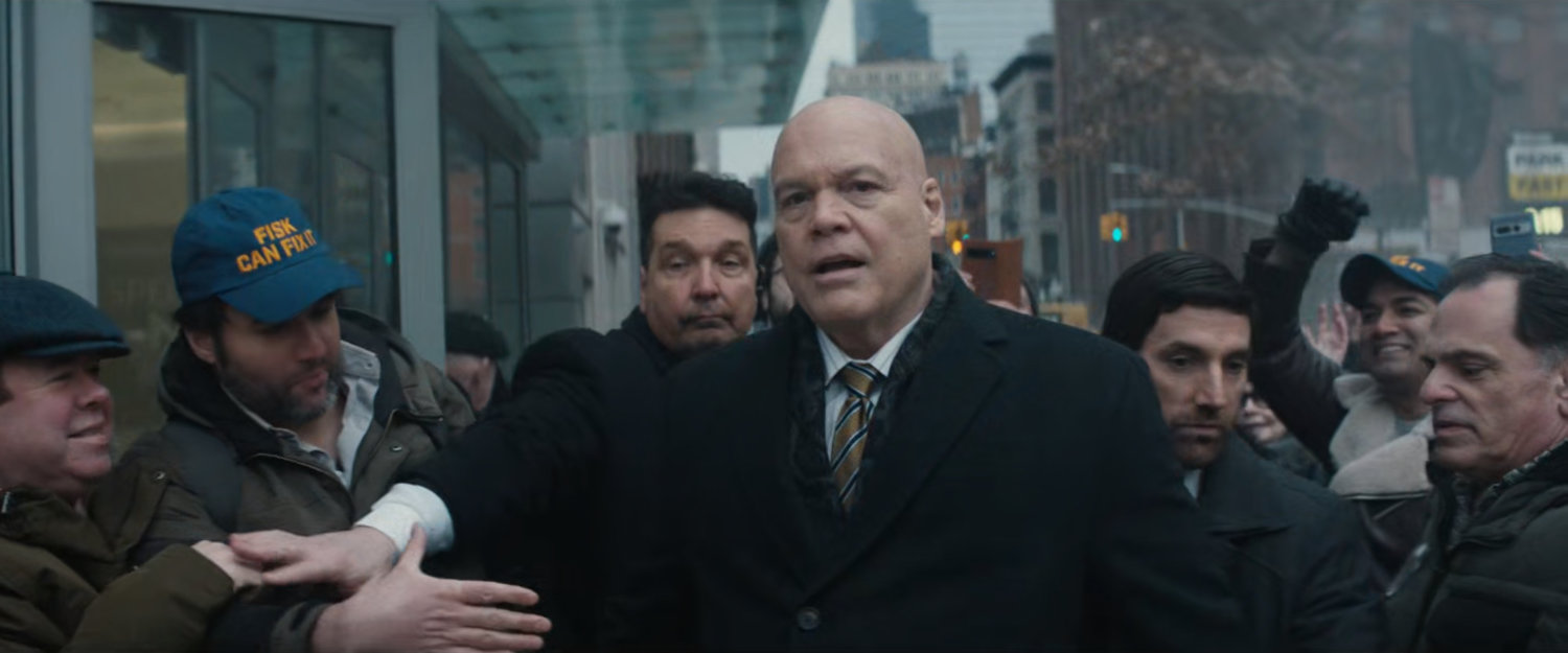 Fisk and a crowd of people outside his hotel.
