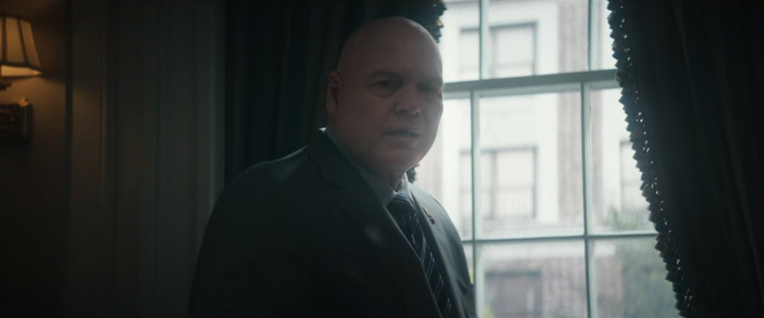 Fisk standing by the window of his office in City Hall.