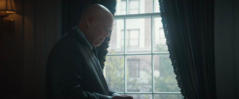 Fisk standing by the window of his office in City Hall.