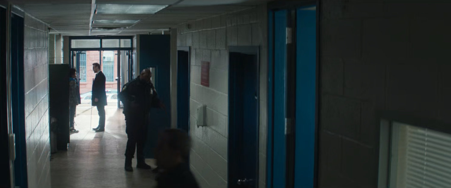 Matt in a hallway at the 15th Precinct Police Station.