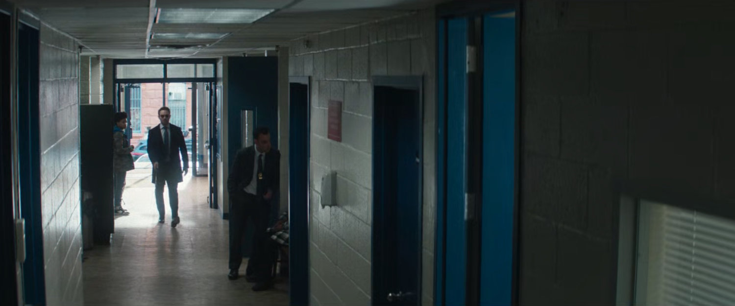 Matt in a hallway at the 15th Precinct Police Station.