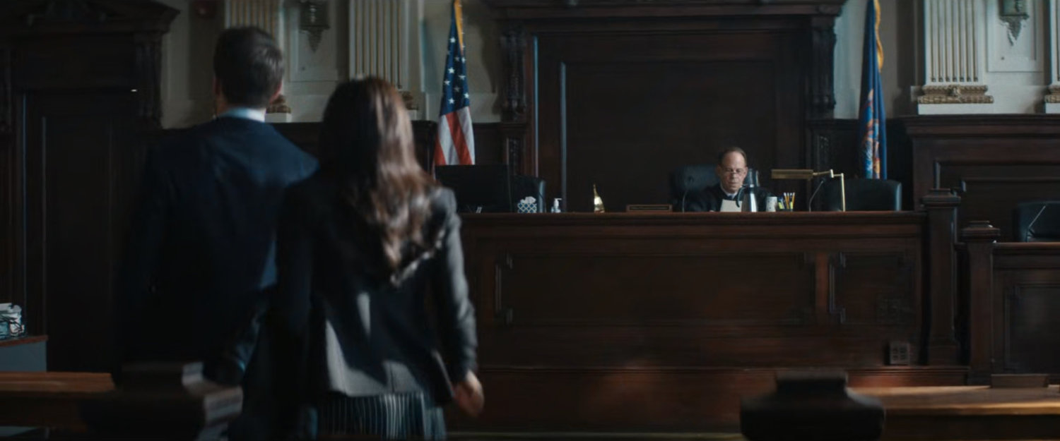 Matt and Kirsten enter a courtroom.