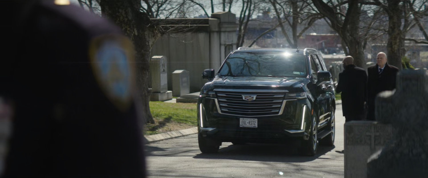 Fisk outside his SUV at a police funeral.