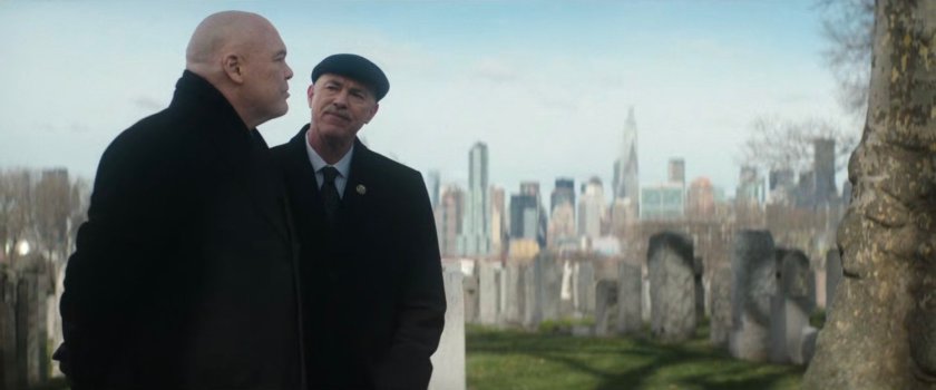 Mayor Fisk and Chief Gallo talking at cemetery.