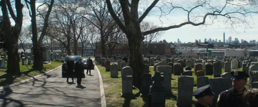 Wide shot of Gallo walking away from Fisk.