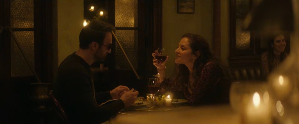 Matt and Heather share an intimate meal at a restaurant.