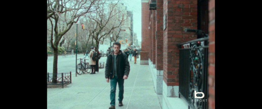 BB Report: Man walking along sidewalk.