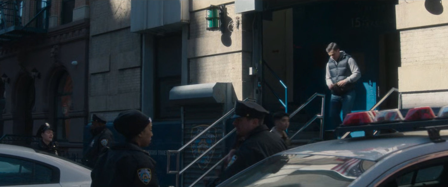 Officer Powell leaves the 15th Precinct Police Station.