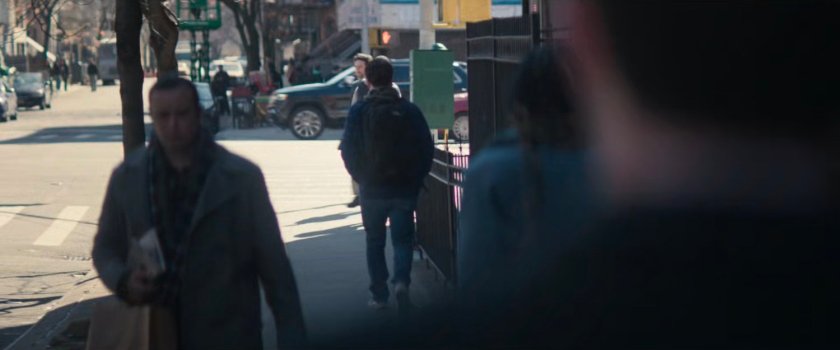 Powell followed by Matt at a corner near Powell's apartment.