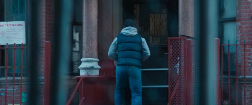 Powell on the sidewalk near his apartment.