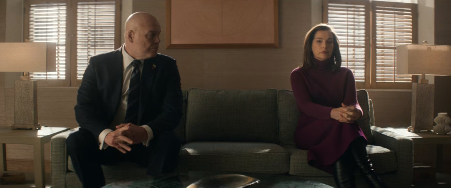 Wilson and Vanessa Fisk on a couch in Heather's office.