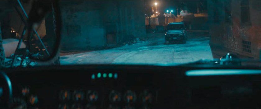 POV from a truck in a dark alley at Red Hook port.