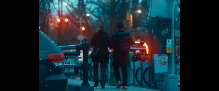 BB Report: a couple walking along a sidewalk.