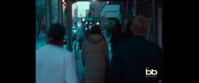 BB Report: people walking on sidewalk under construction overhang.