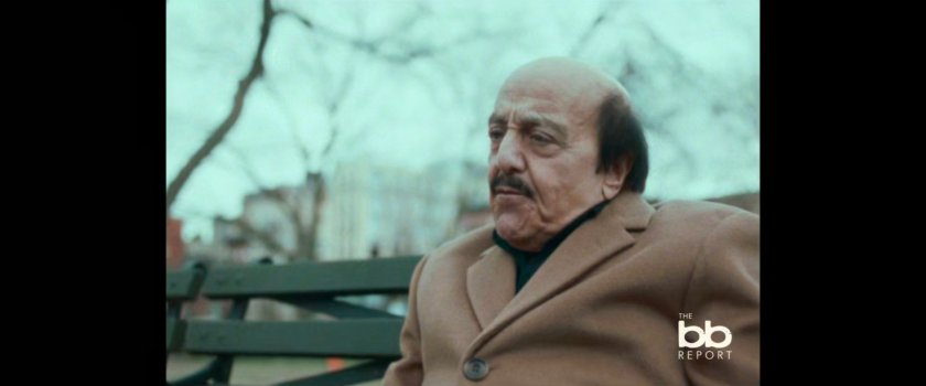 BB Report: man interviewed on park bench.