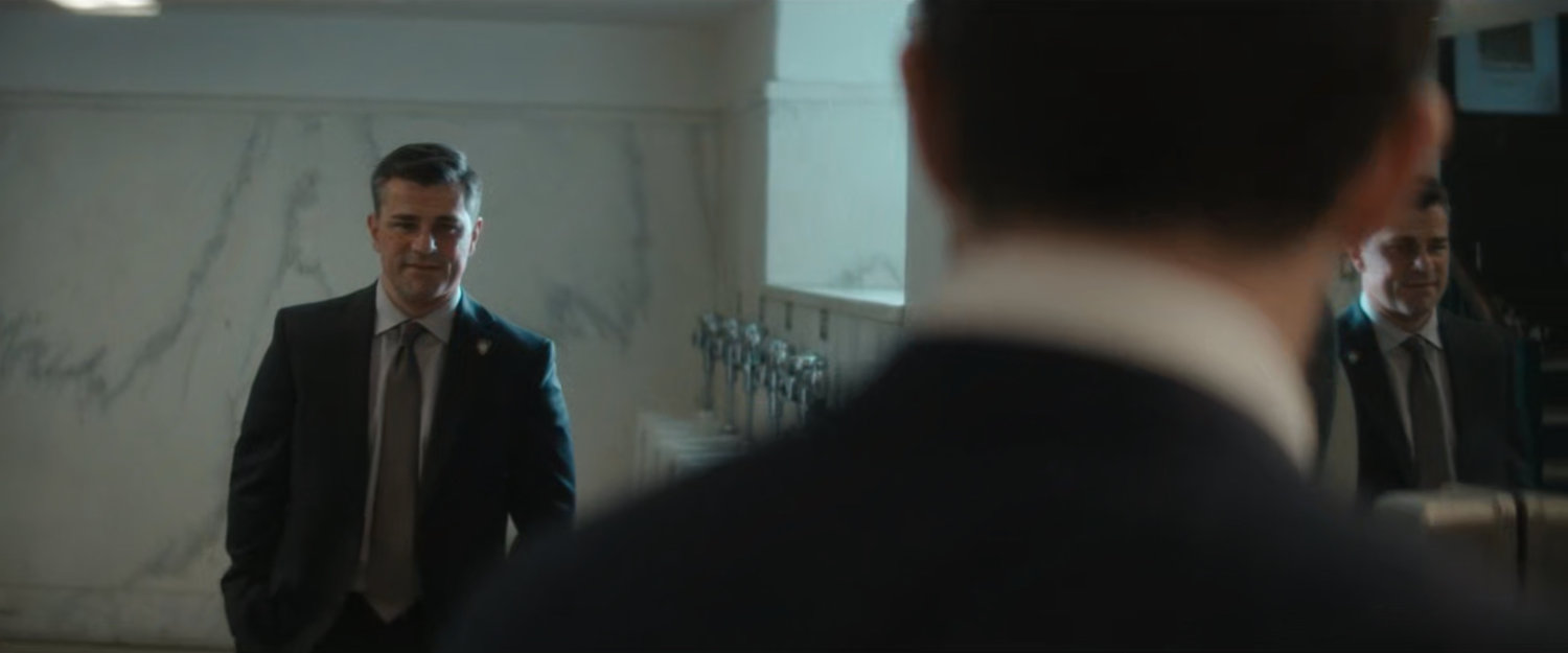 Matt and Officer Powell in the bathroom of the courthouse.
