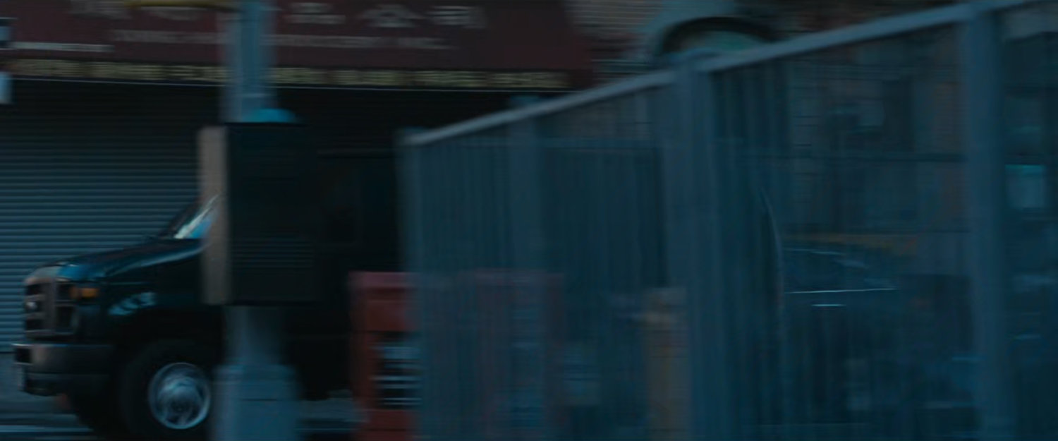 Van speeding by corner.