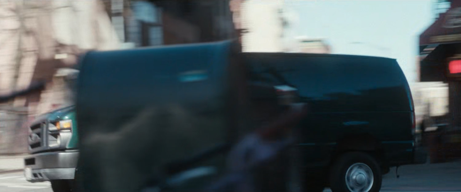 Van speeding around corner.