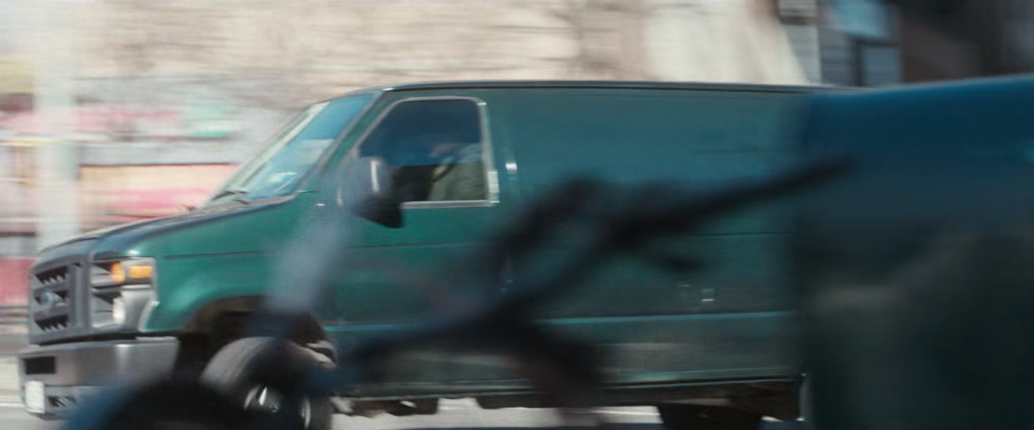 Van speeding around corner.