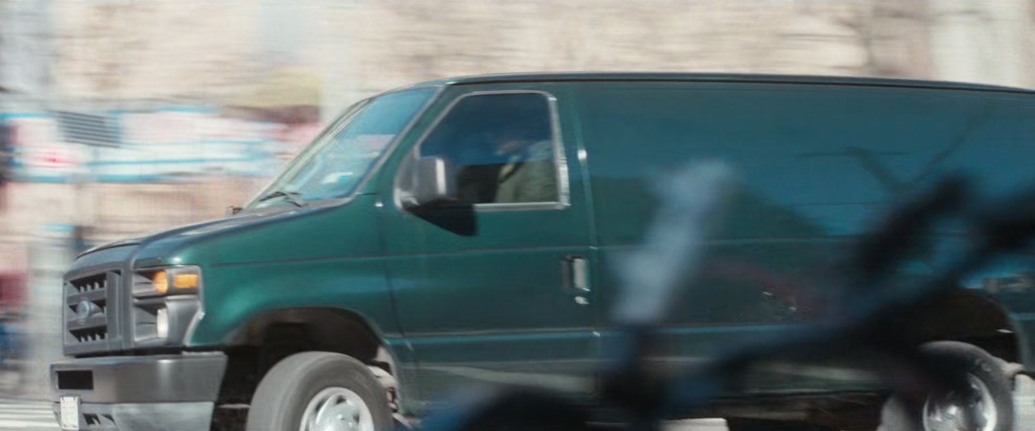 Van speeding around corner.